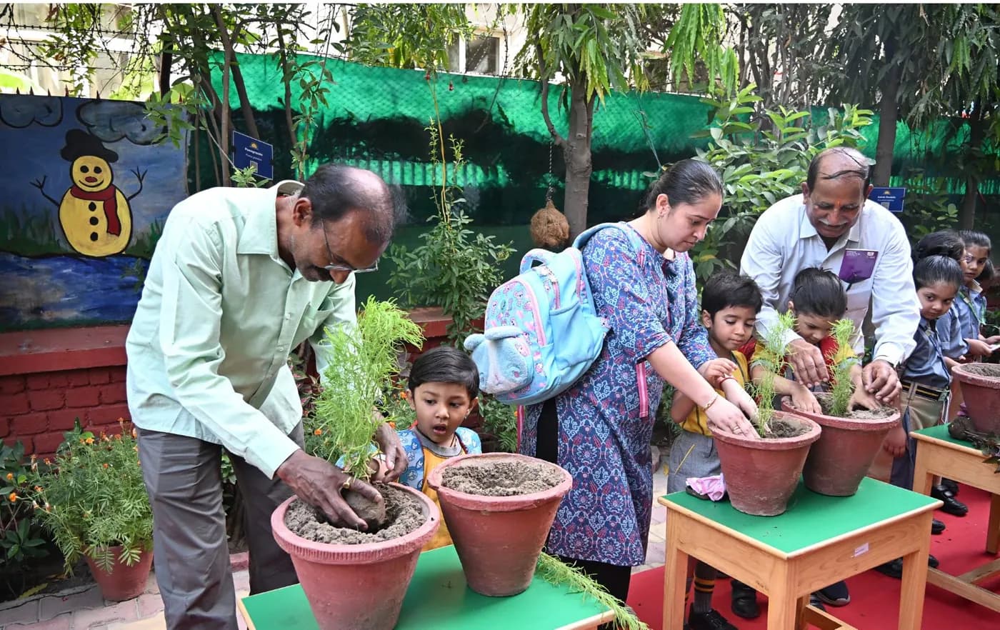 Children and community members planting together